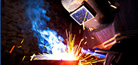 Welder working on metal
